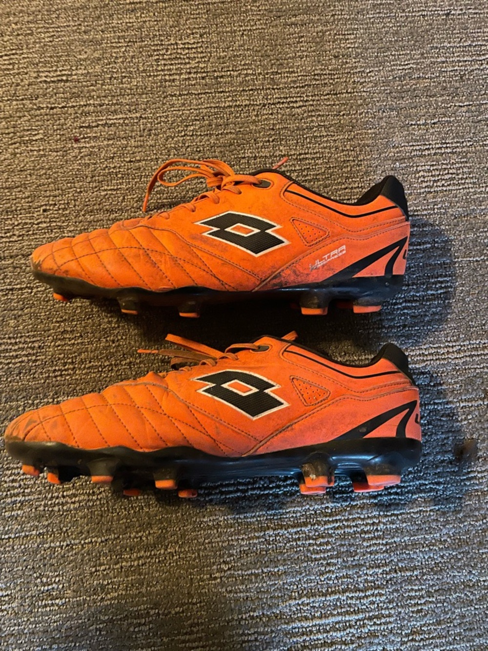 LOTTO Men's Orange Soccer Cleats with Black Accents
